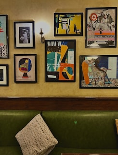 A cozy interior featuring framed canvas art hanging above a sofa