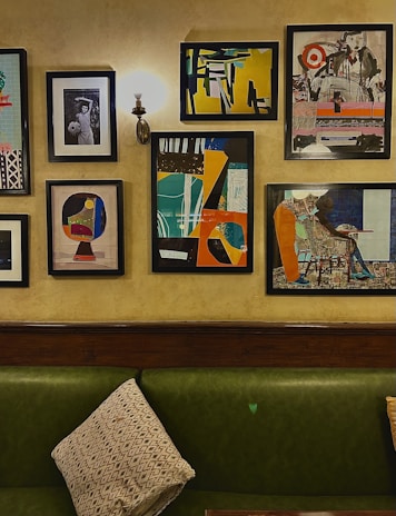 A modern living room wall adorned with framed prints from the Prints Minimal Muse collection.