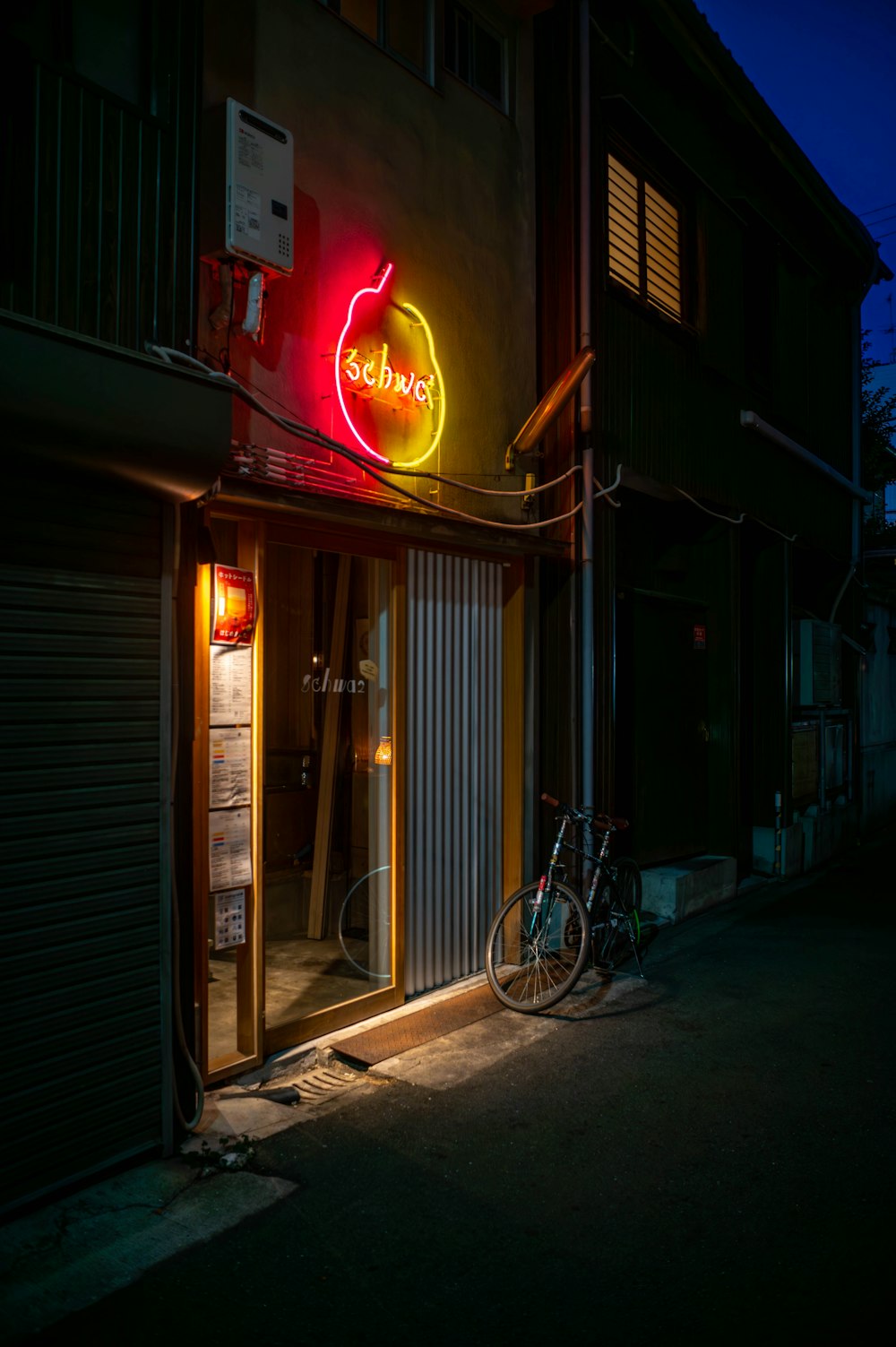 a neon sign on the side of a building