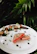 A beautifully plated seafood dish featuring fresh local catch.