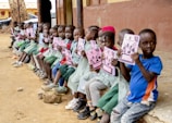 A group of orphans receiving educational materials in a mission-supported school