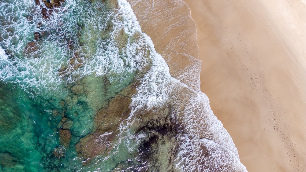 a bird's eye view of a beach and ocean