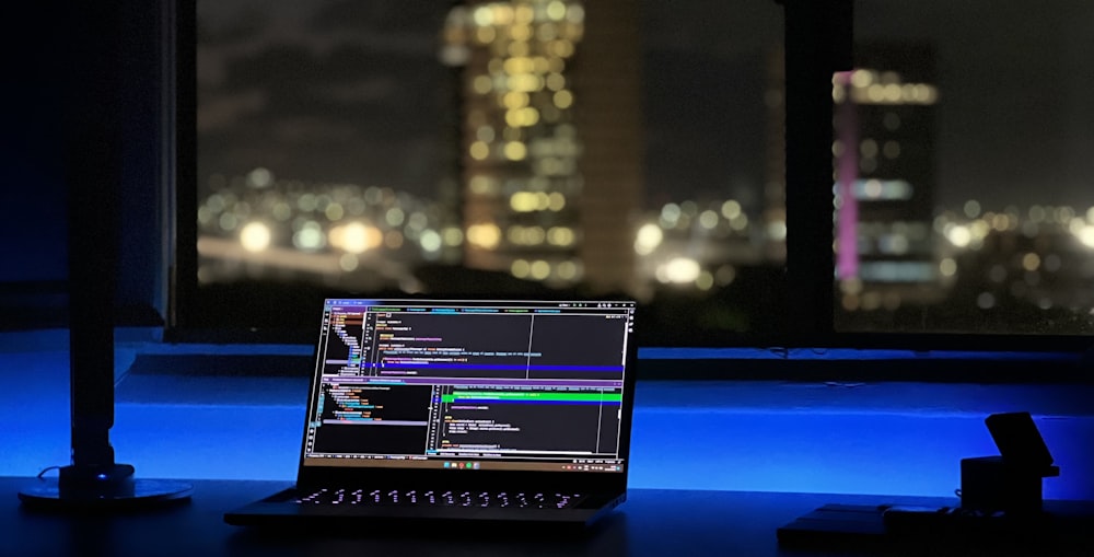 a laptop computer sitting on top of a desk