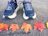 Close-up of running shoes on a trail covered with autumn leaves.