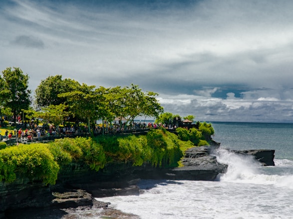 A diverse group of travelers enjoying a scenic coastal tour together.