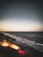 A couple enjoying a drive along a beautiful beachfront.