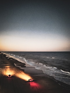 A couple enjoying a drive along a beautiful beachfront.