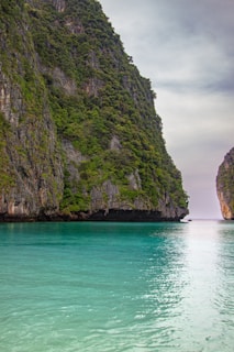 a body of water with a mountain in the background