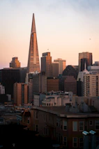 Cityscape of Mexico City with a focus on the Benito Juárez area at sunset.