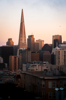 Cityscape of Mexico City with a focus on the Benito Juárez area at sunset.