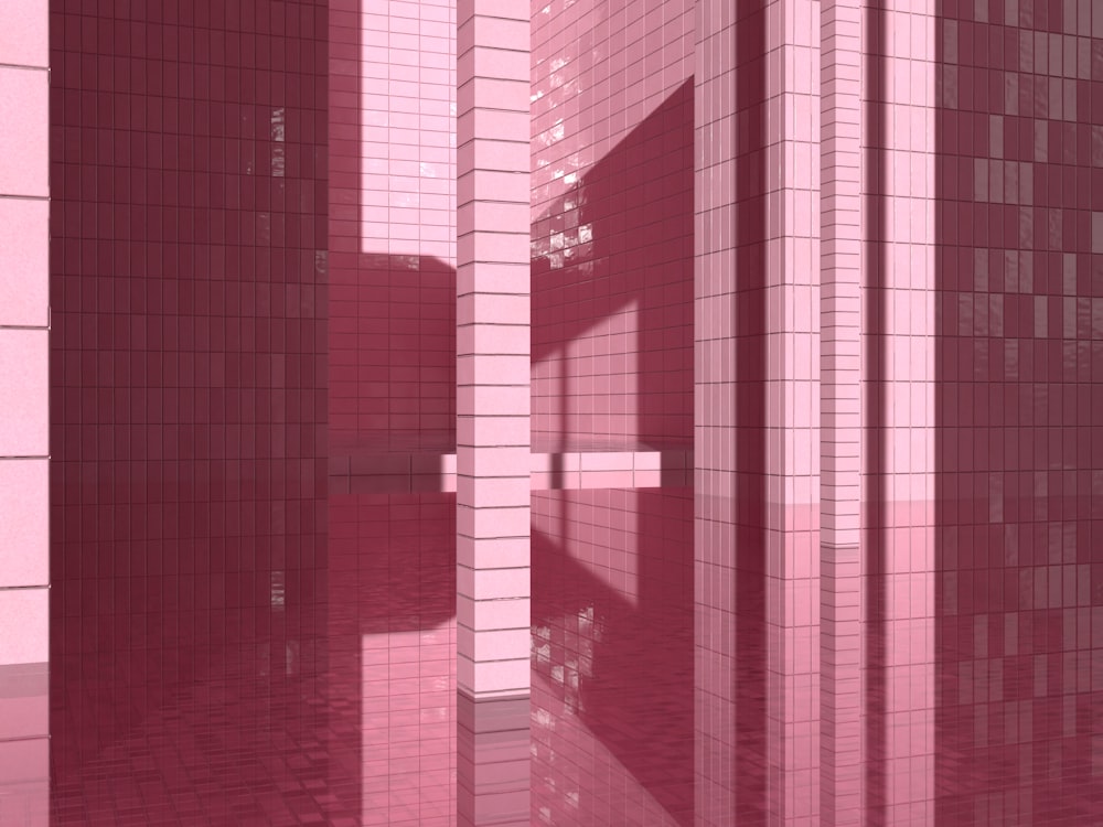 a room with pink tiles on the walls and floor