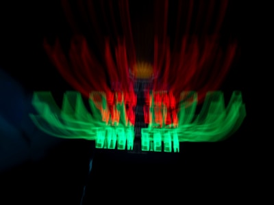 Animated neon buttons with glitch effects shining against a black screen.