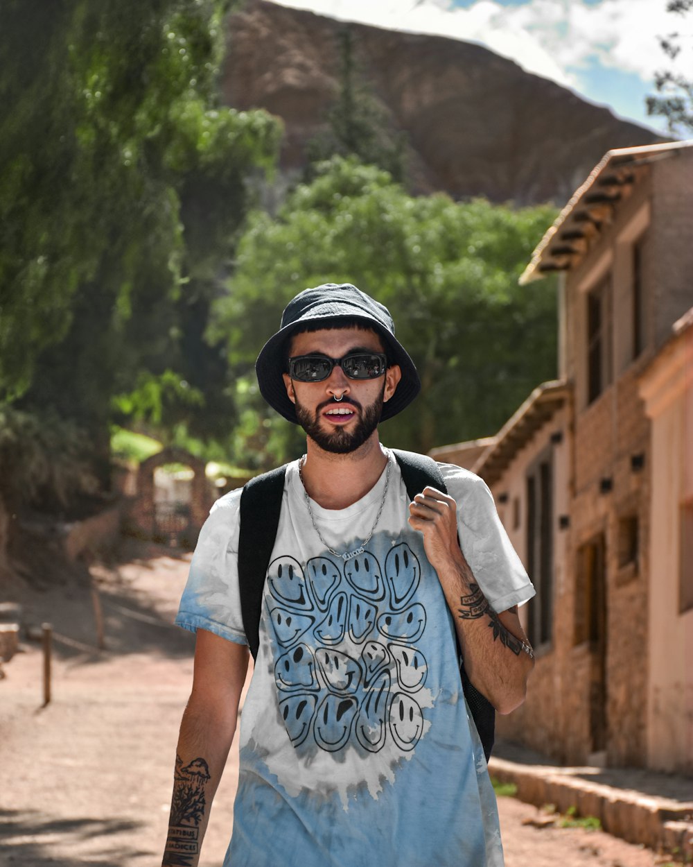 a man walking down a street with a backpack