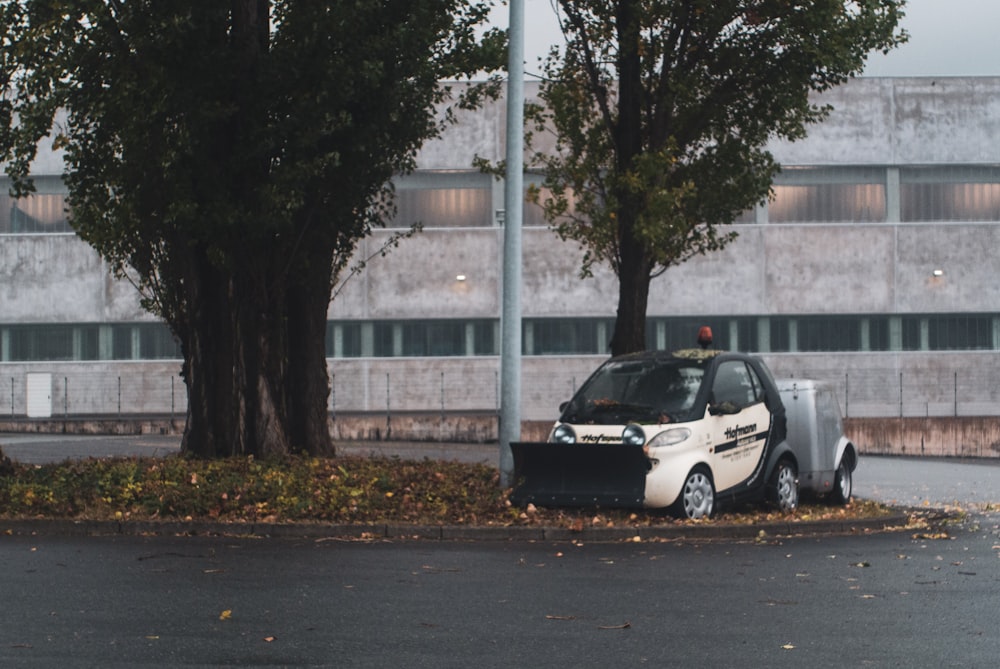 a small car parked on the side of a road