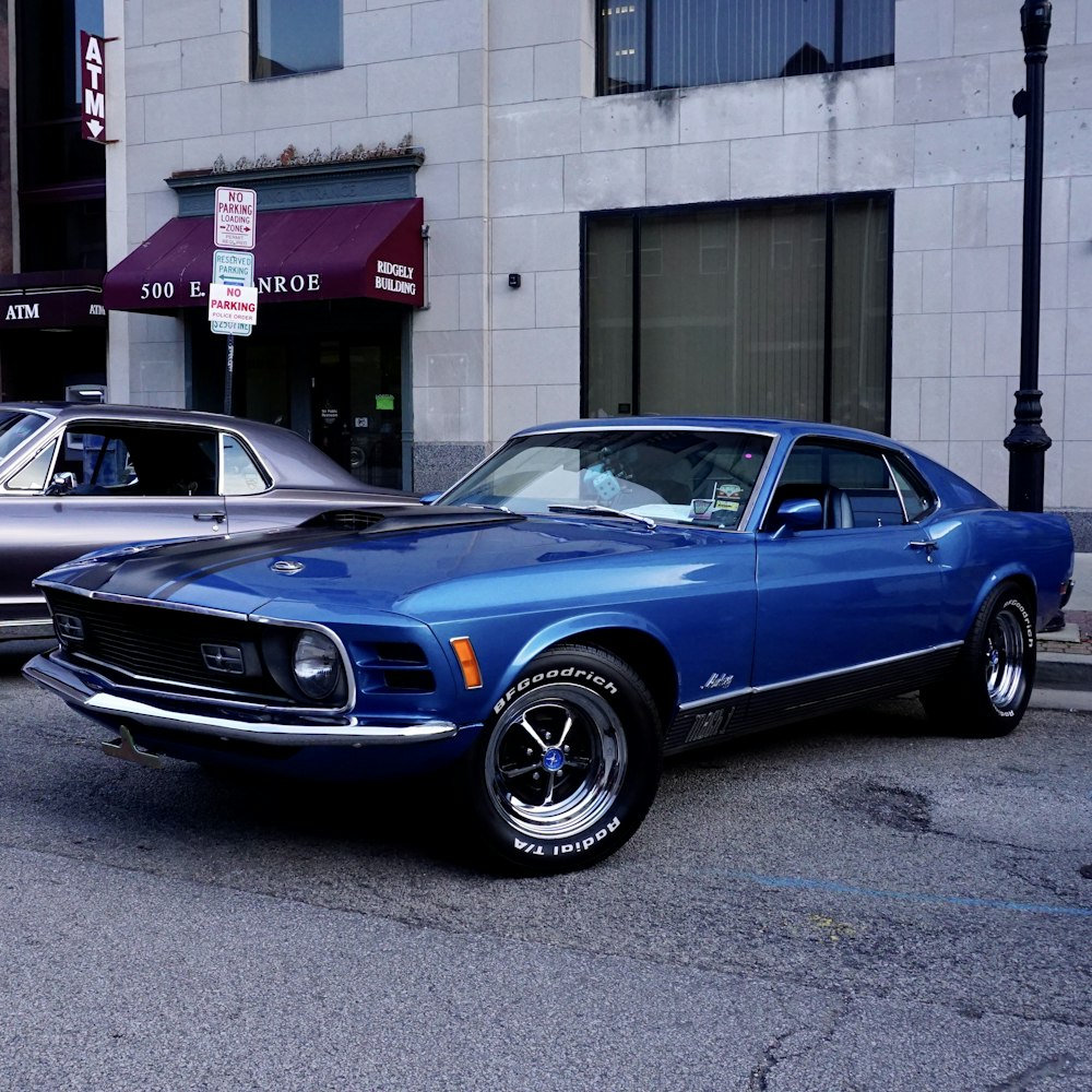 a blue car parked on the side of the road