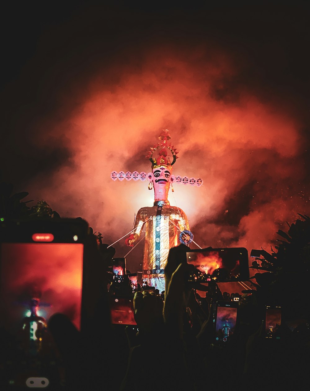 a person standing on top of a stage in front of a crowd