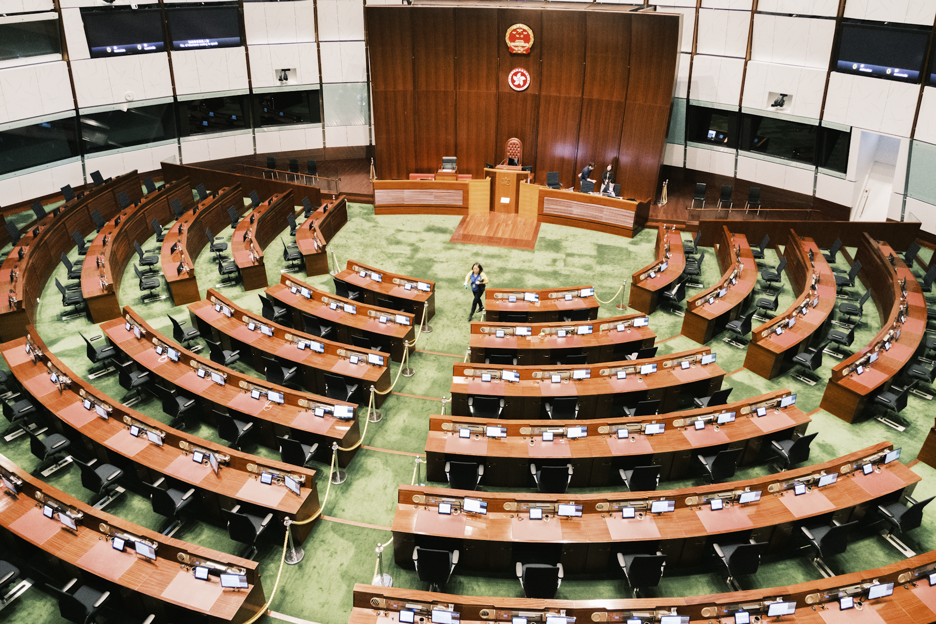 a large room filled with lots of wooden chairs