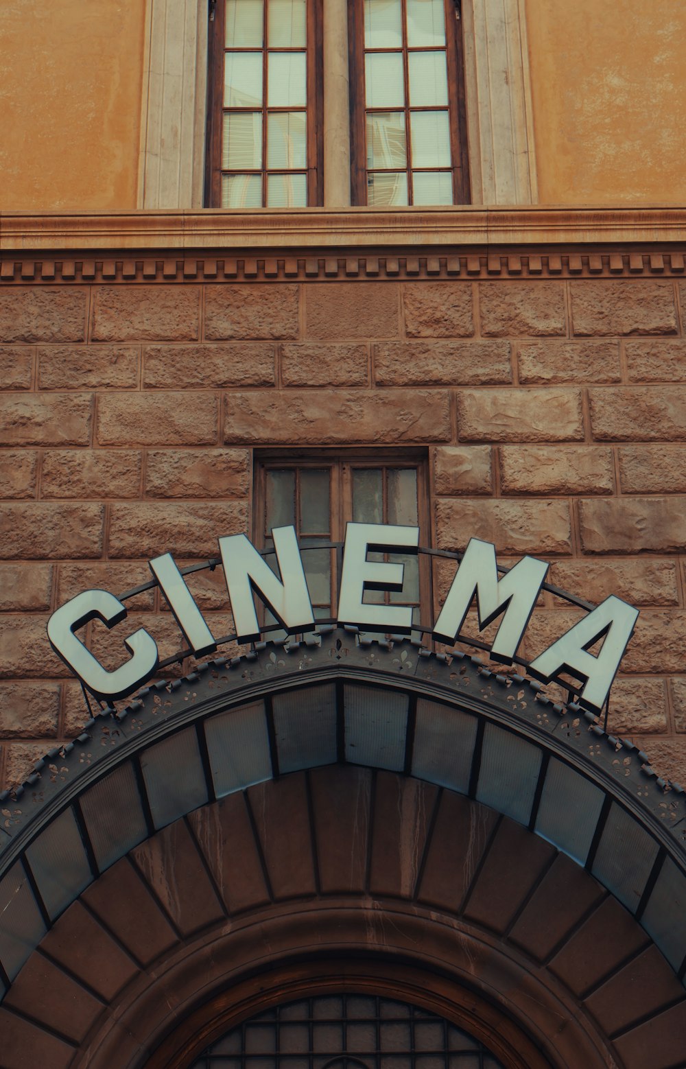 a sign that reads cinema above a doorway