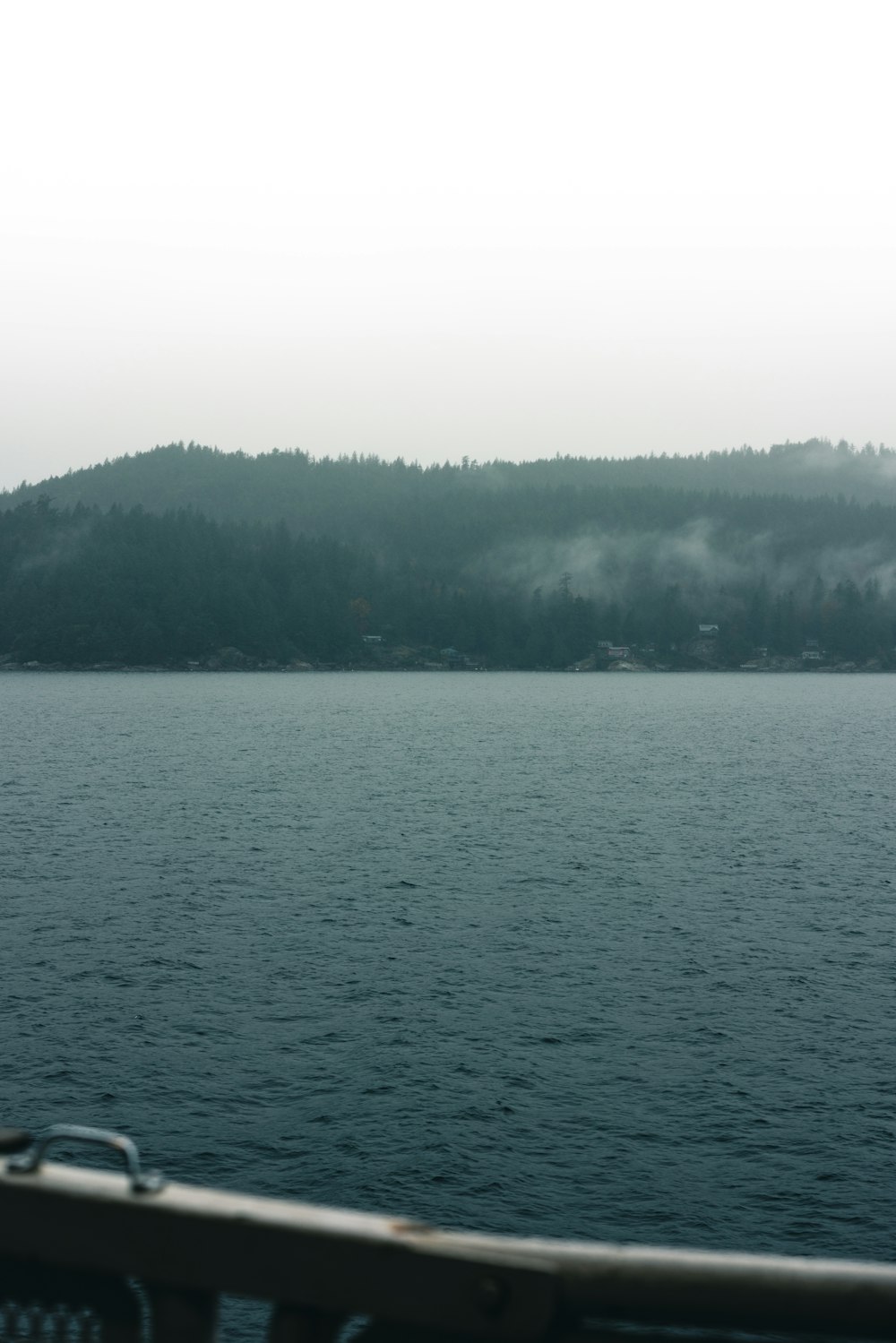 a view of a body of water with a mountain in the background