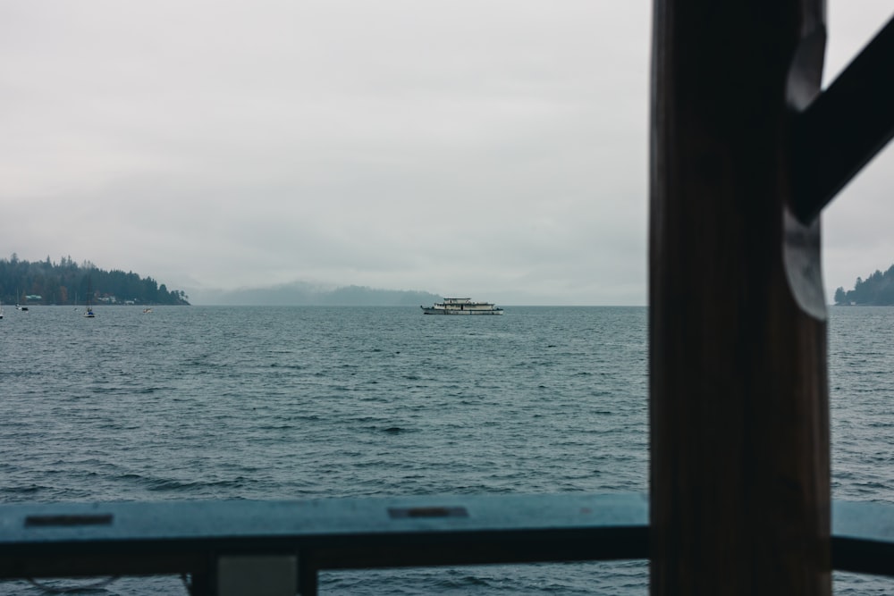 a boat is out on the water on a cloudy day