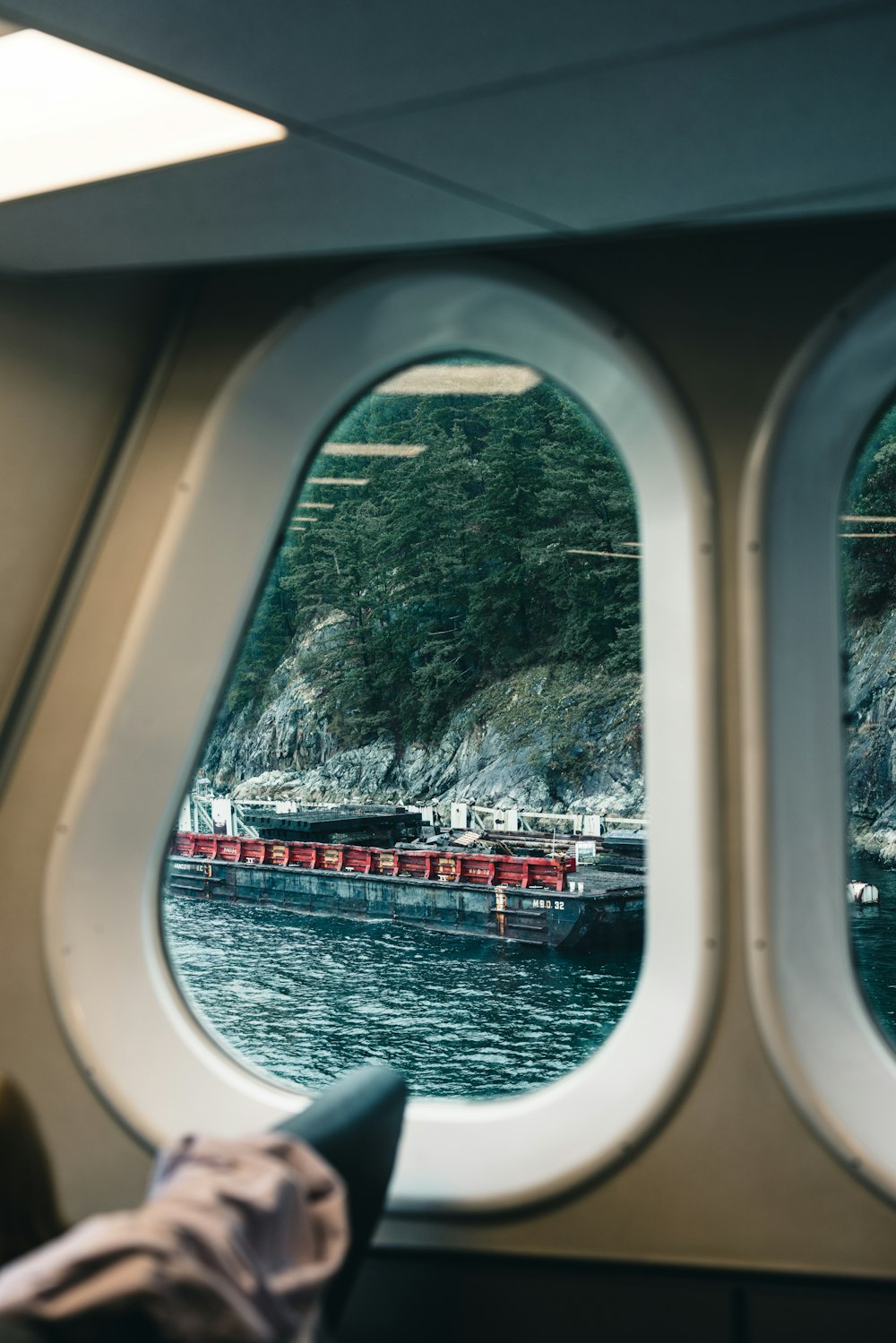 a view of a boat from inside an airplane window