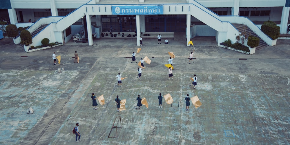 a group of people standing in front of a building