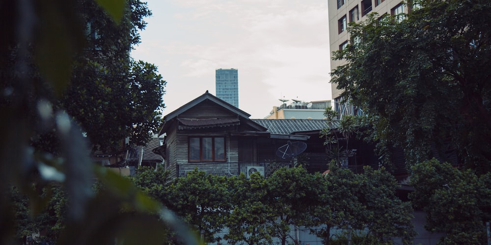 a house with a clock tower in the background