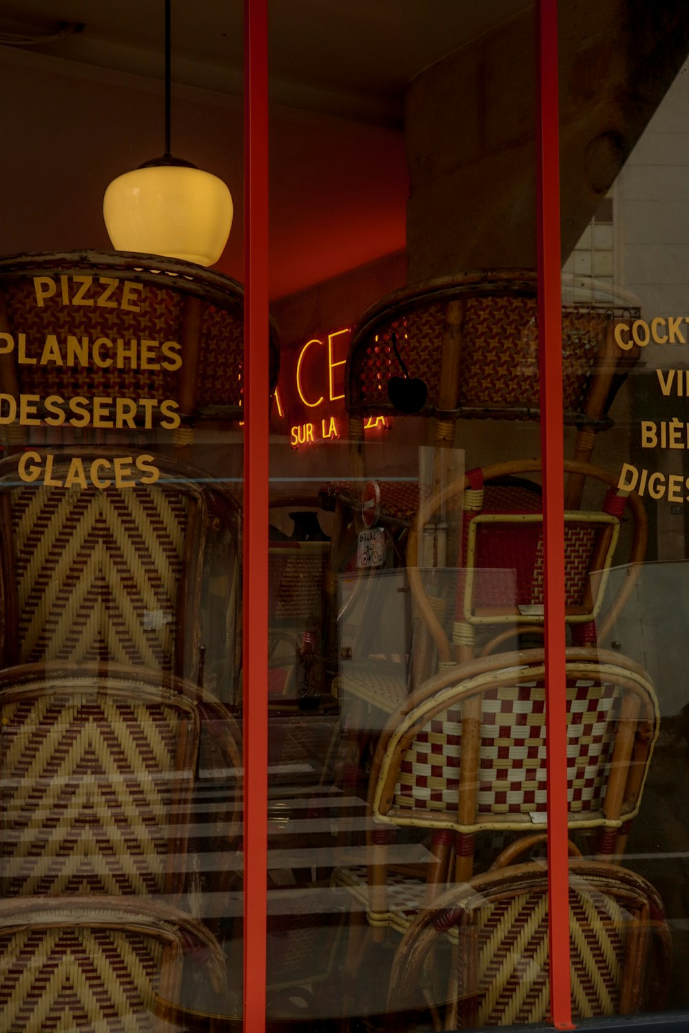 a store front window with chairs in it