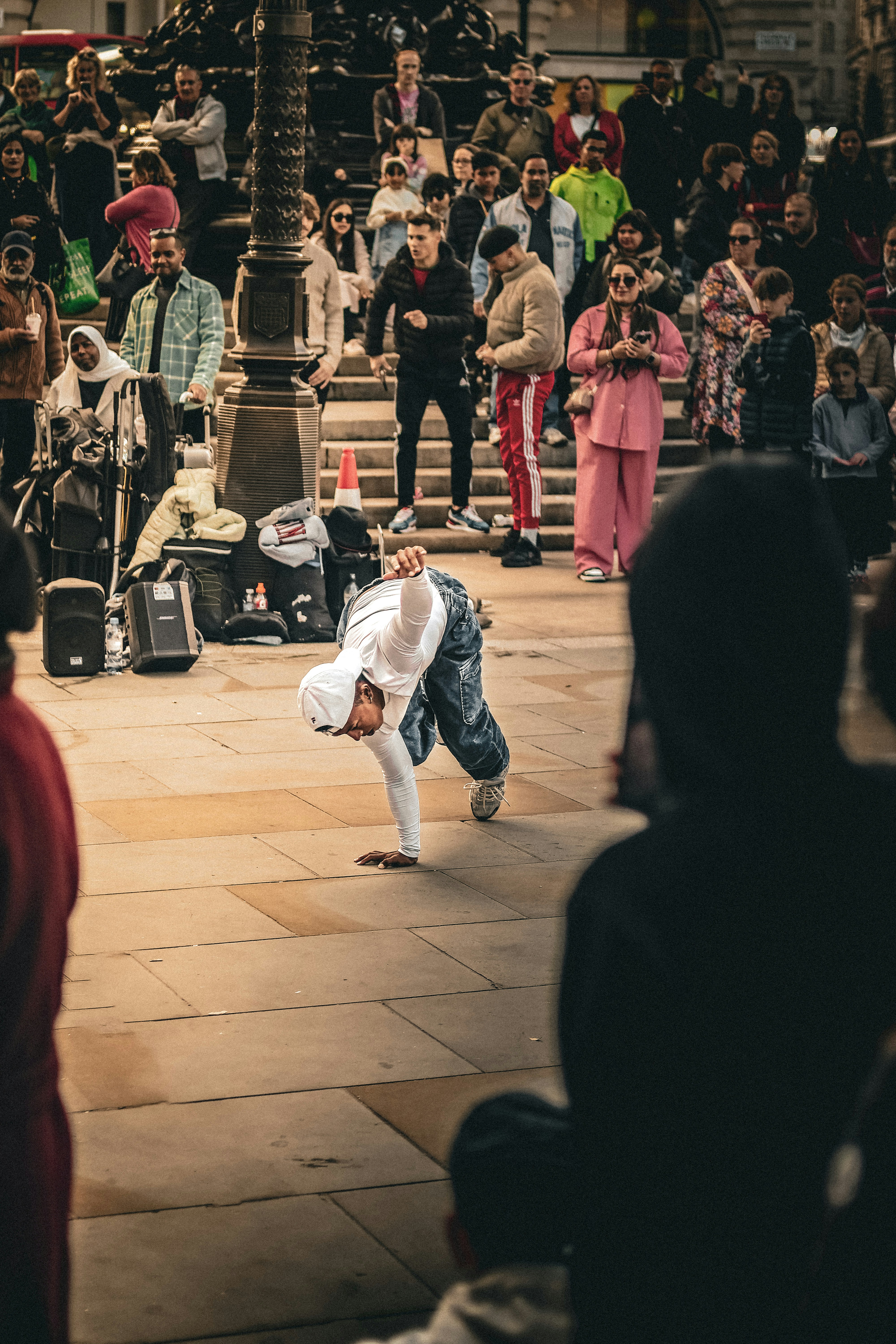a person doing a trick on a skateboard in front of a crowd