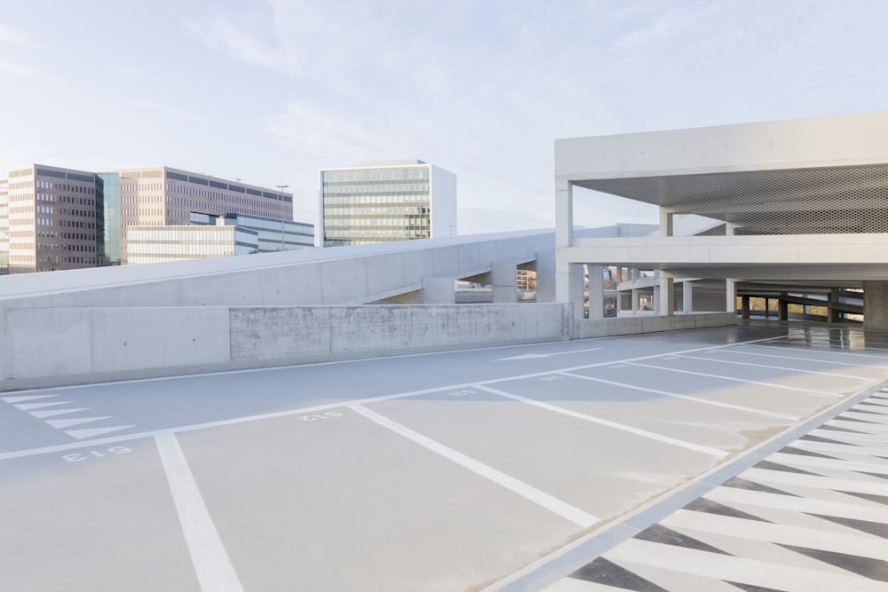 an empty parking lot in front of a building