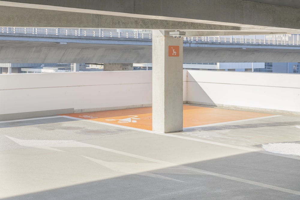 an empty parking lot with a parking meter