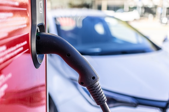a car is parked next to a gas pump