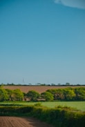 An image of a wind turbine in a scenic landscape.