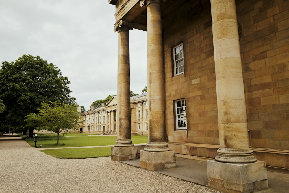 a stone building with columns and a clock tower