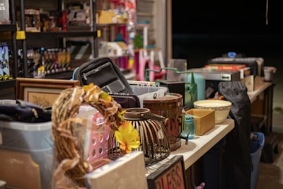 A colorful display of various gift items arranged on a wooden table.