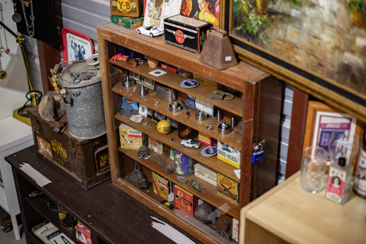 A cozy corner of Route 11 Antique Mall showcasing a rustic wooden cabinet filled with vintage trinkets.