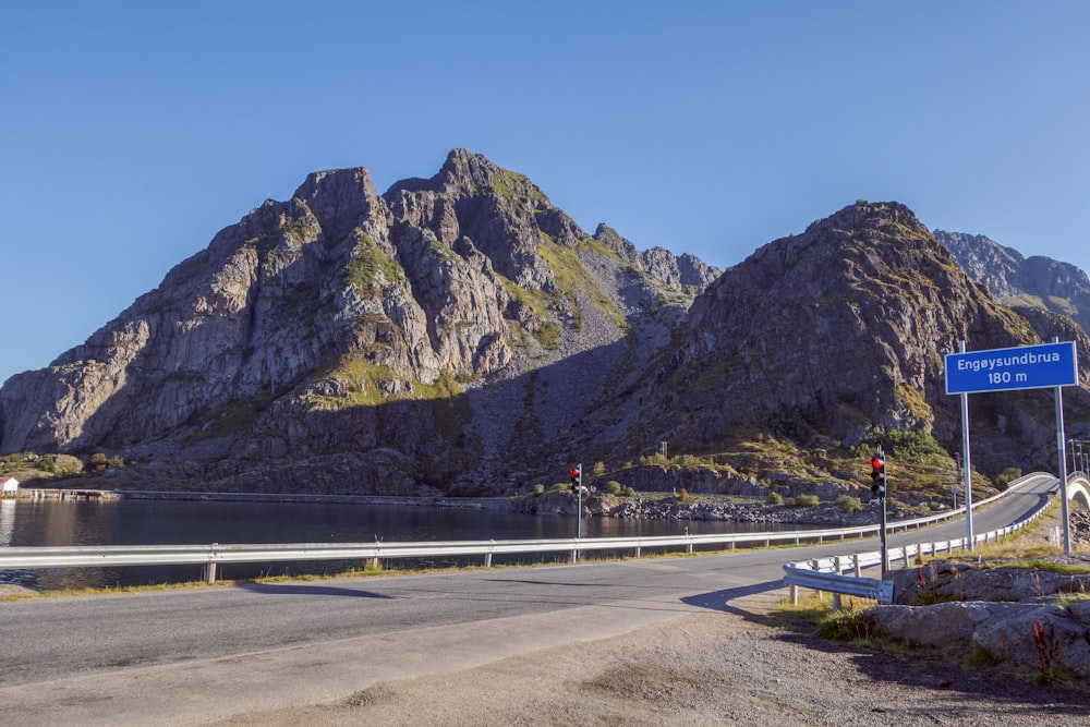 a road with a mountain in the background