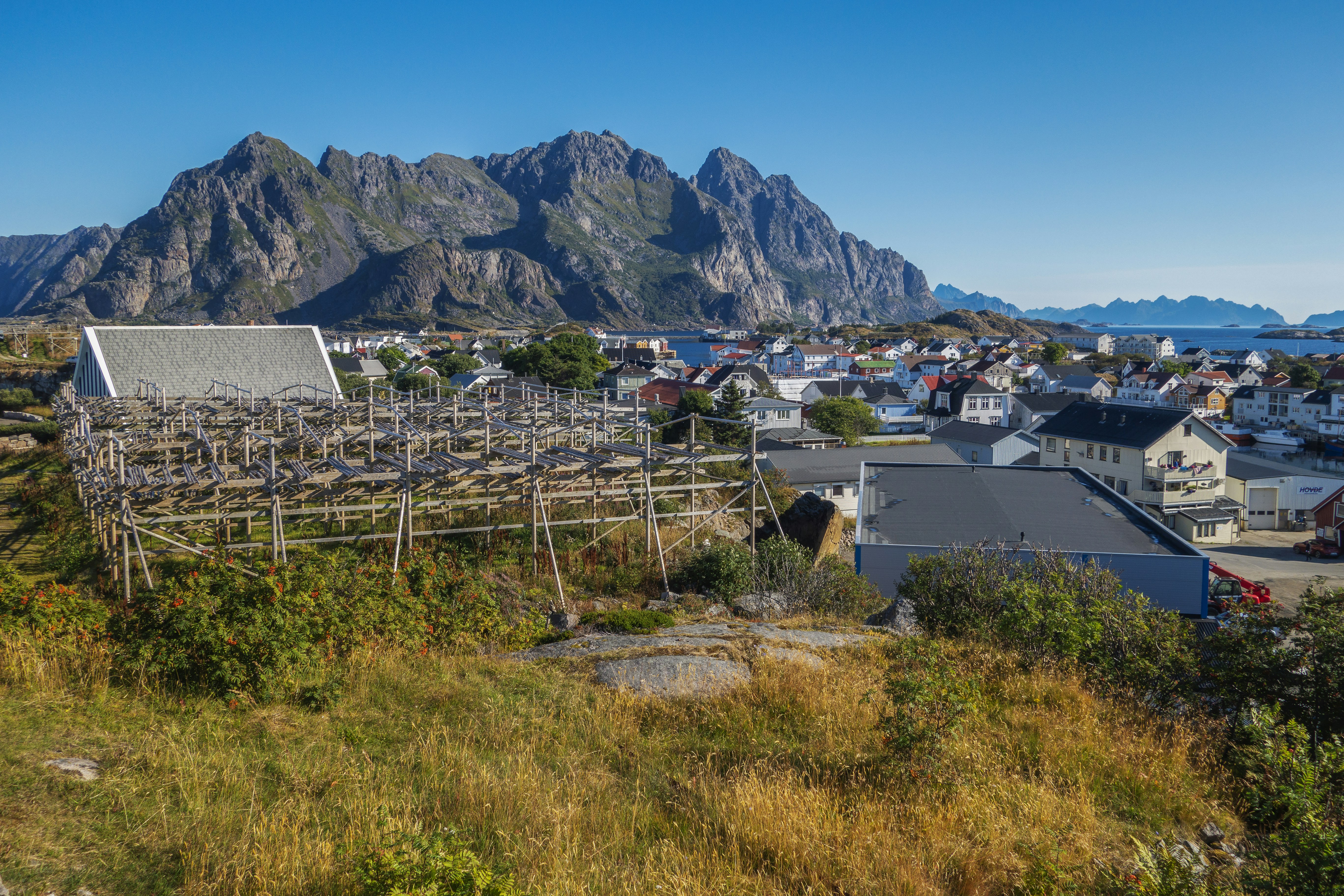 a view of a town with mountains in the background