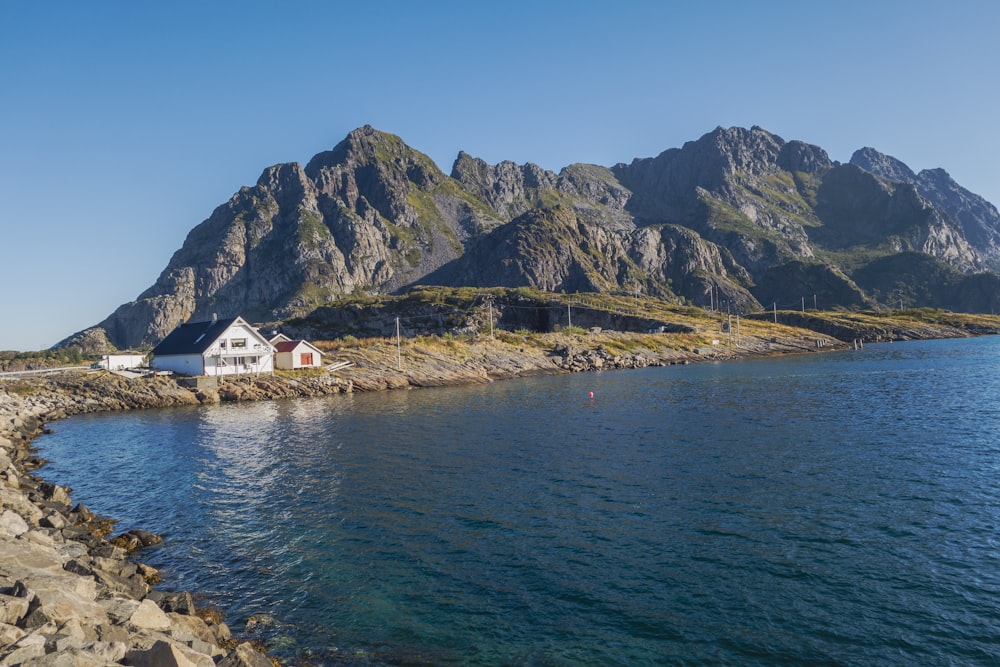 a body of water with a mountain in the background