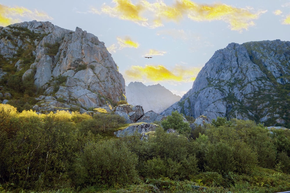 a plane is flying over a mountain range