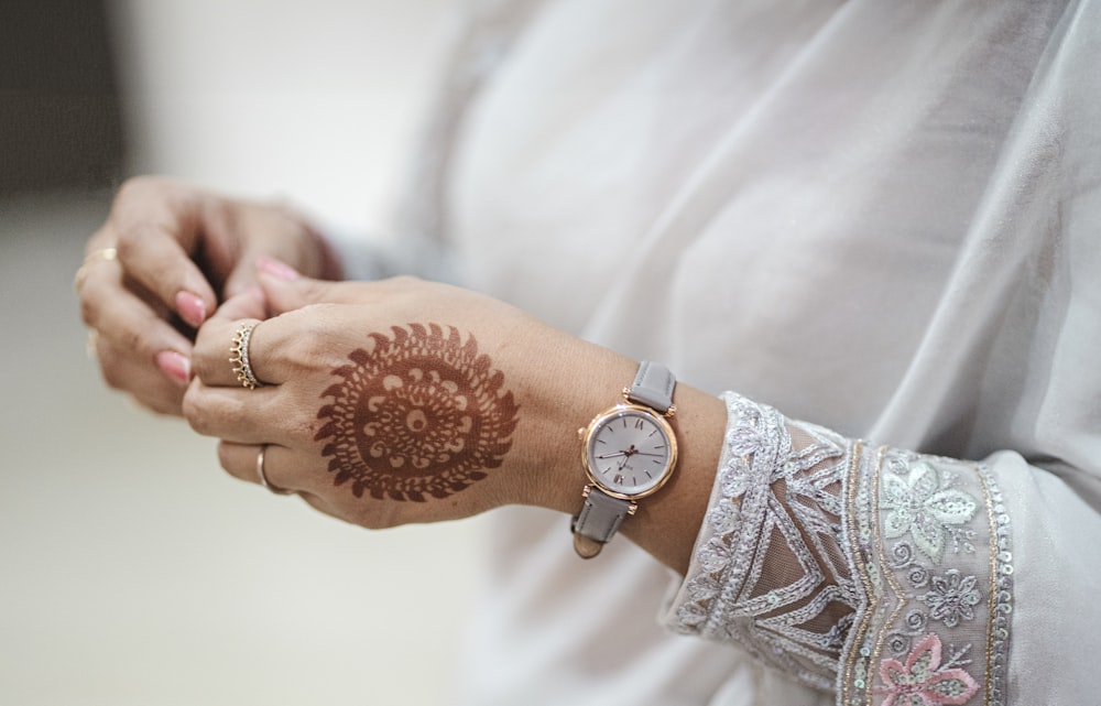 a close up of a person wearing a wrist watch