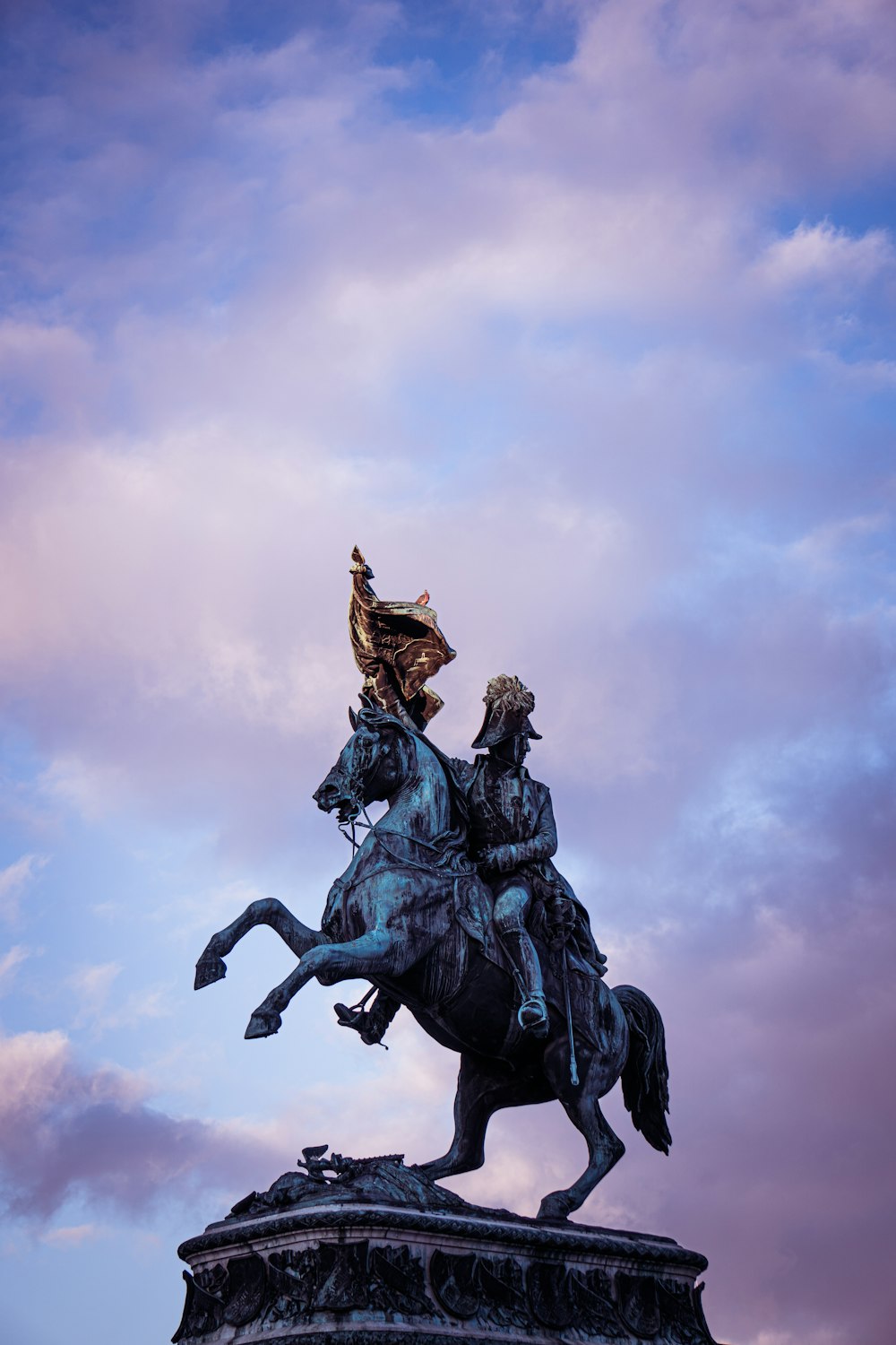 a statue of a man riding on the back of a horse