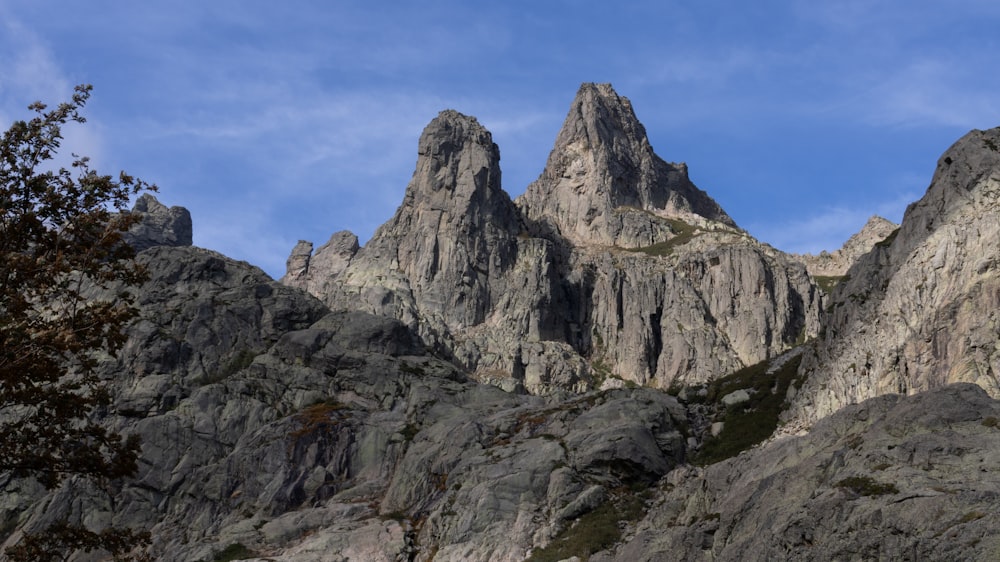 a group of mountains with a blue sky in the background