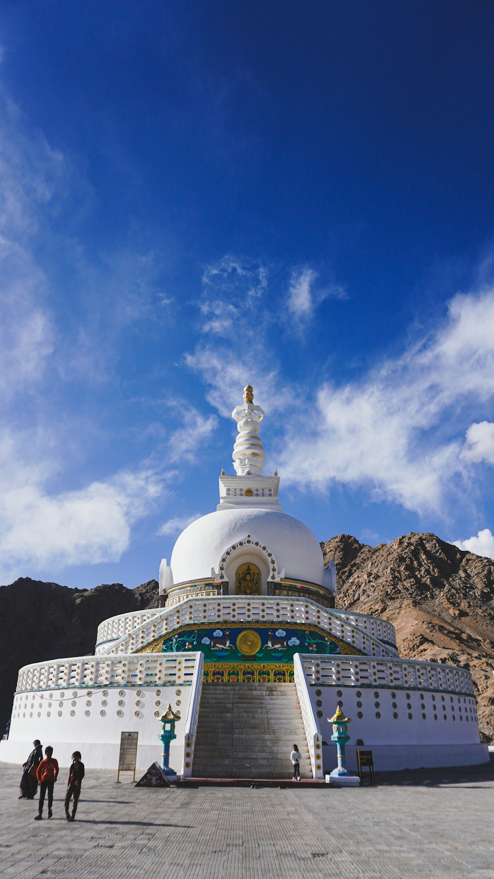 a large white building sitting on top of a mountain