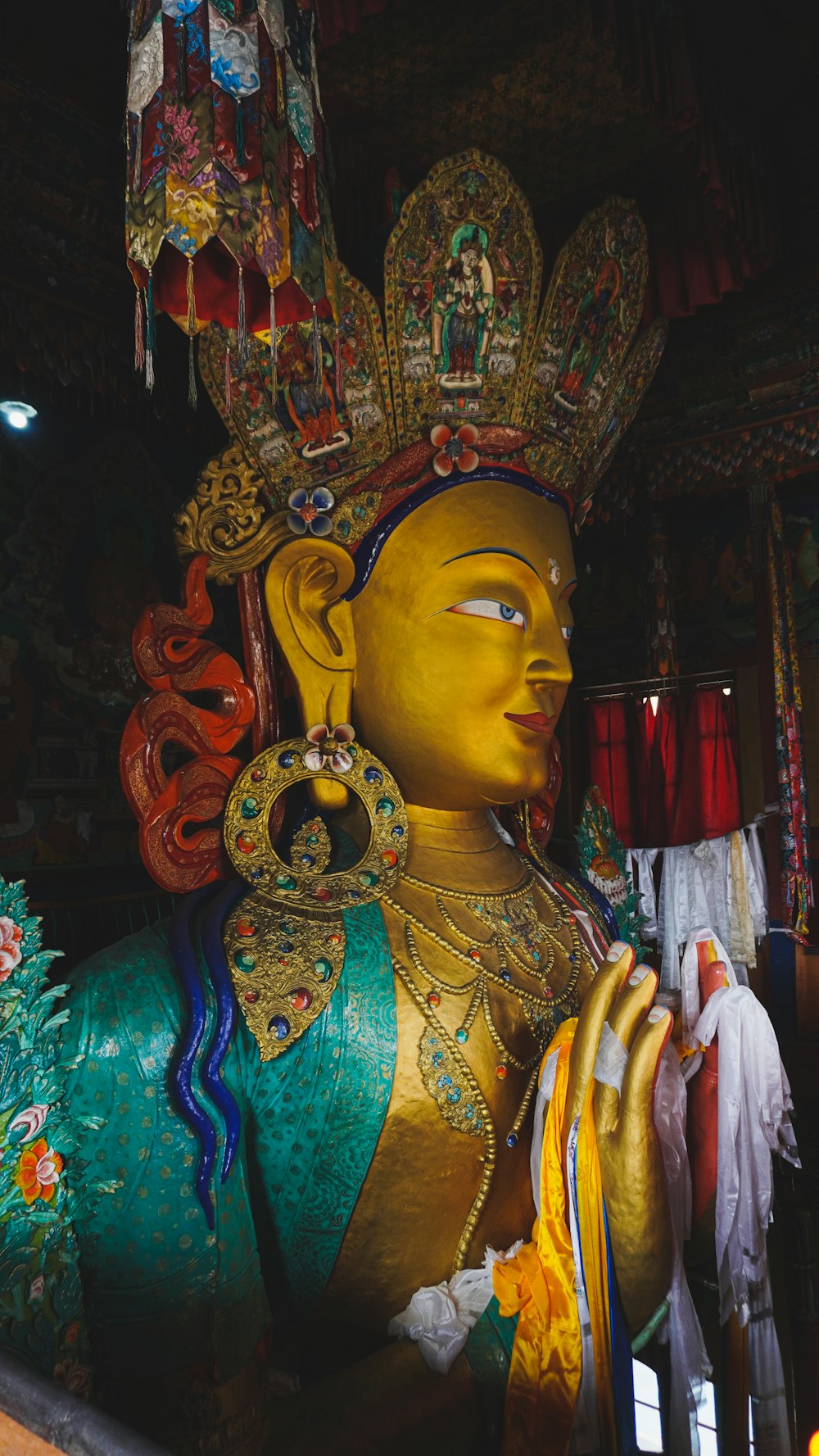 a large statue of a person wearing a headdress