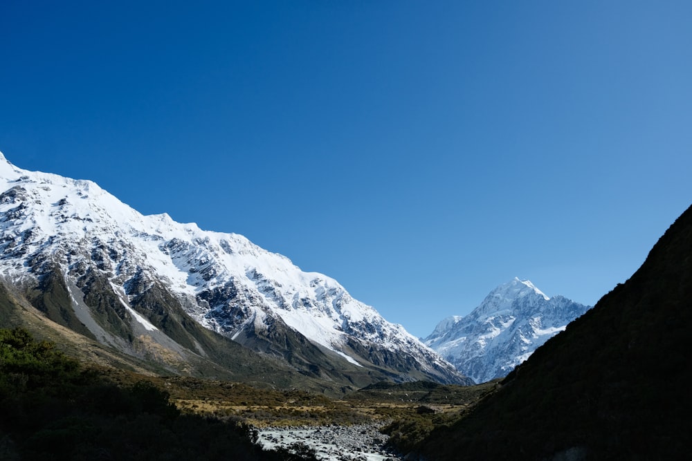 a mountain range with a river running through it