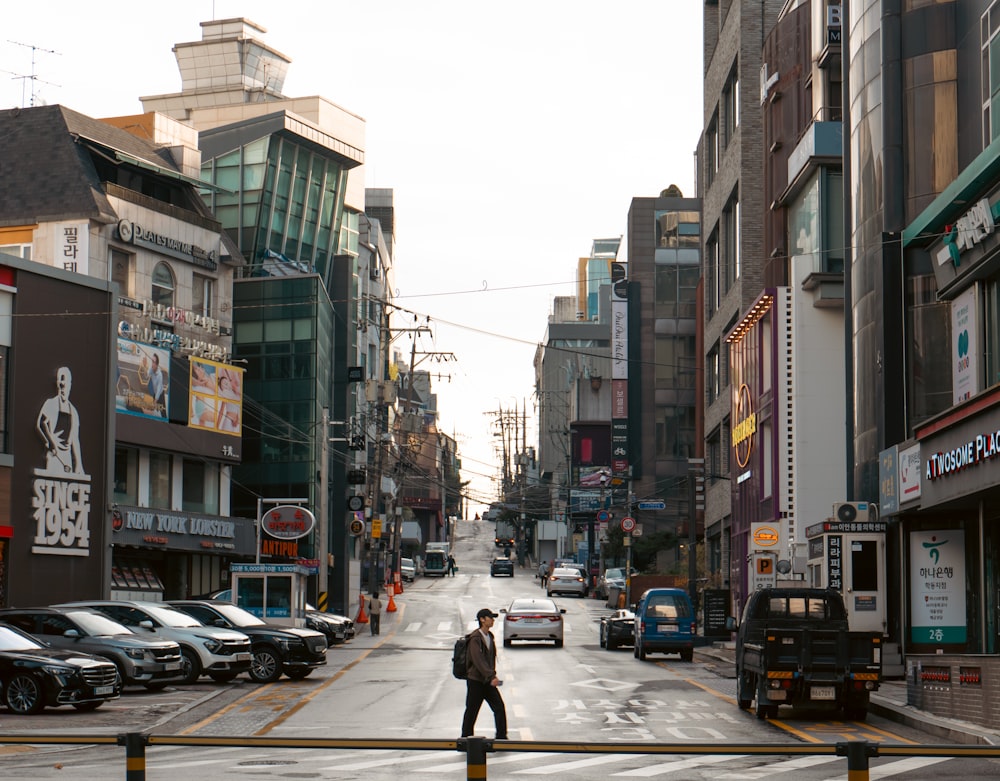 a man standing in the middle of a city street