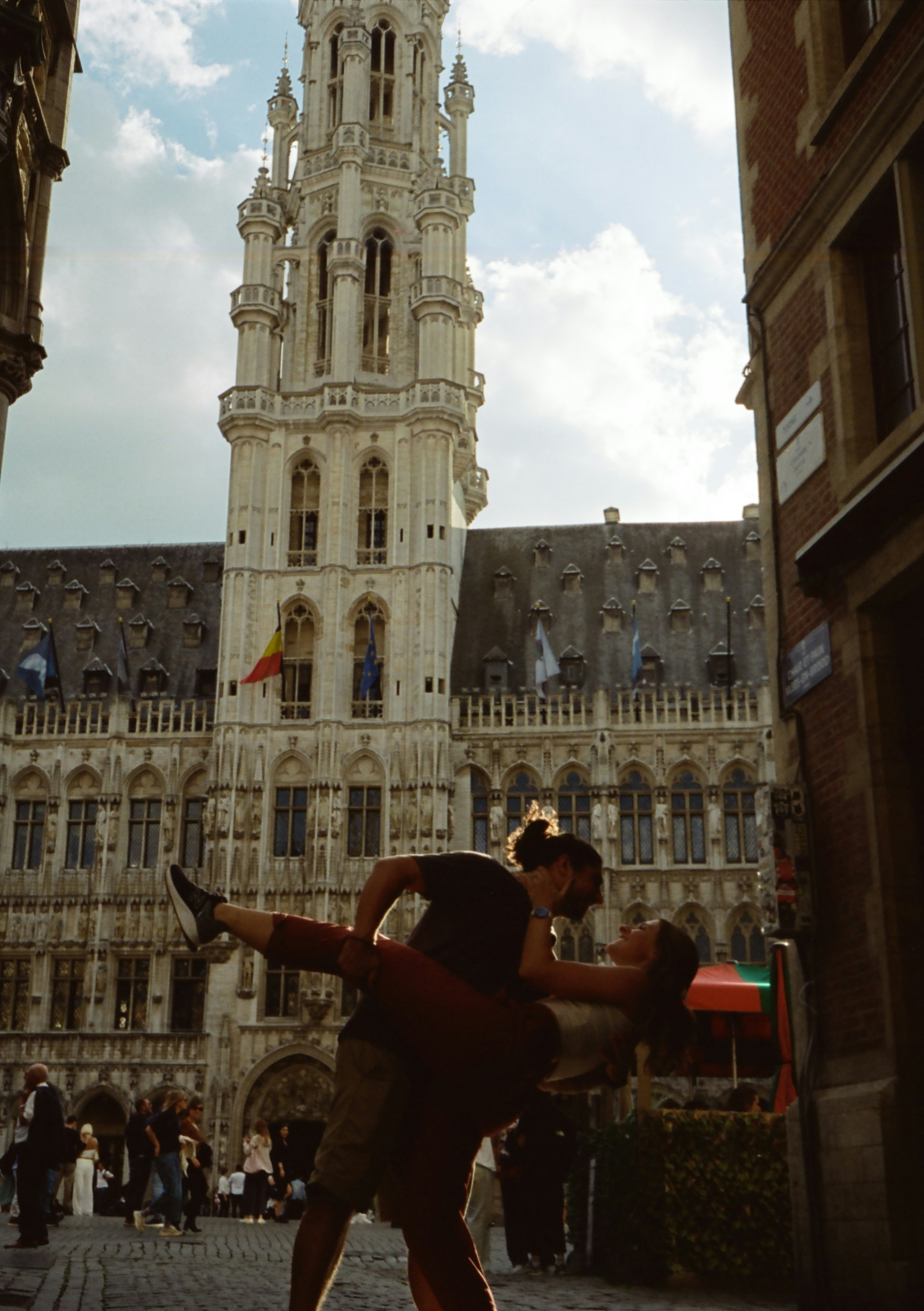 a couple of people that are standing in front of a building