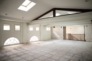 an empty room with a skylight in it