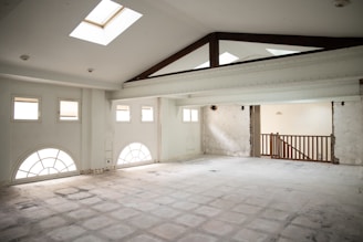 an empty room with a skylight in it